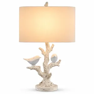 White Textured Resin Table Lamp With Bird And Branch Design, Oval Linen Shade, And Built-in Nightlight