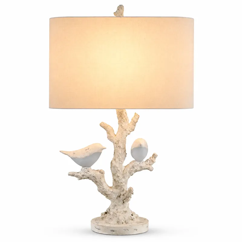 White Textured Resin Table Lamp With Bird And Branch Design, Oval Linen Shade, And Built-in Nightlight