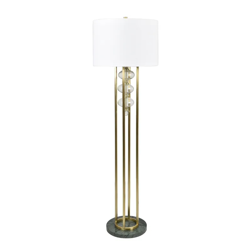 Gold Polished Floor Lamp With White Linen Drum Shade And Marble Base