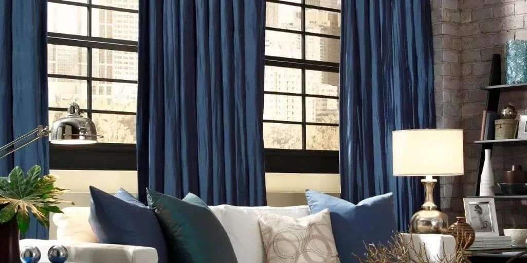 Custom drapery panels framing a window