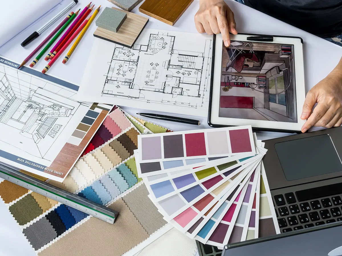 Designer reviewing a room layout and floor plan