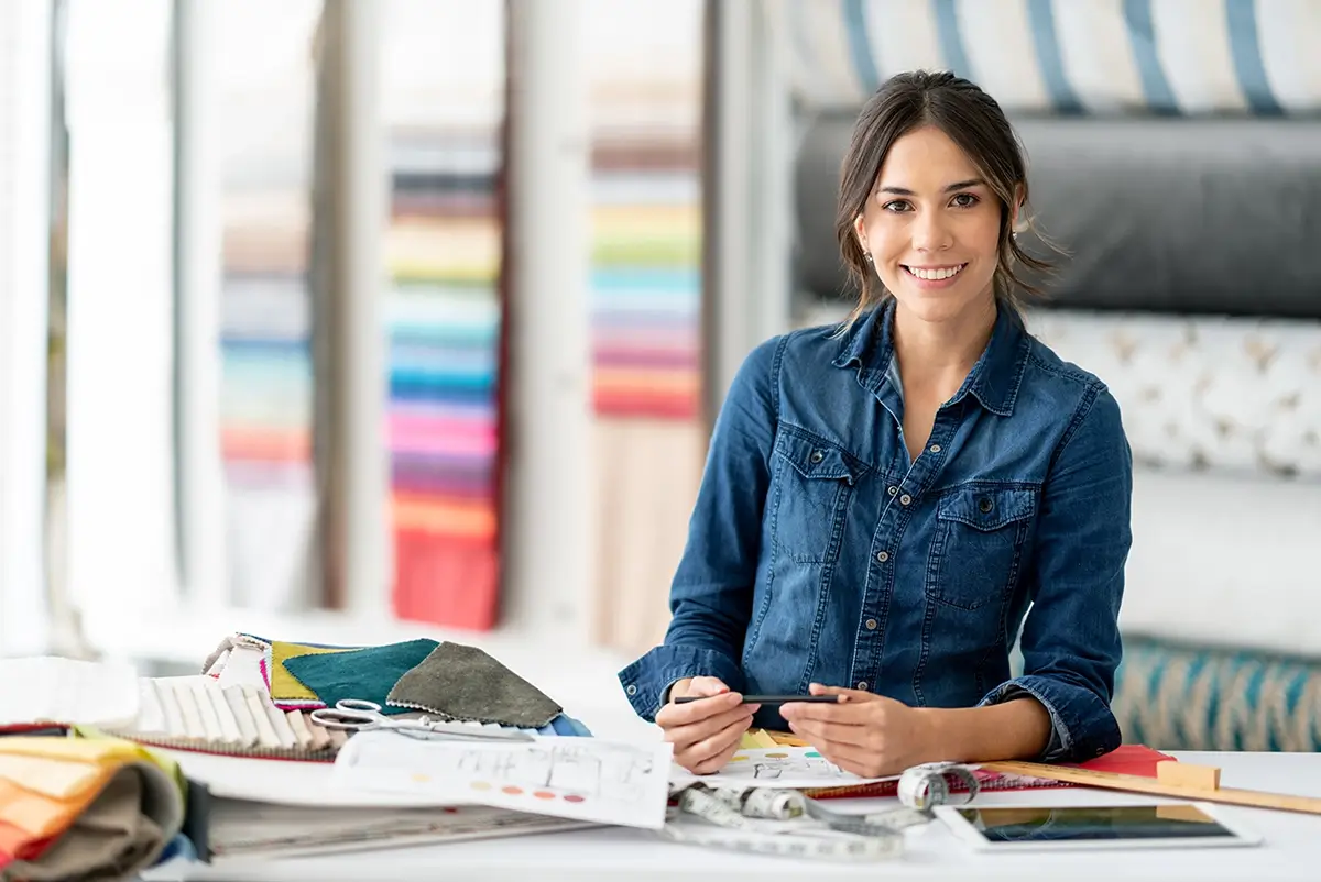 Salesperson helping a customer selecting a mattress