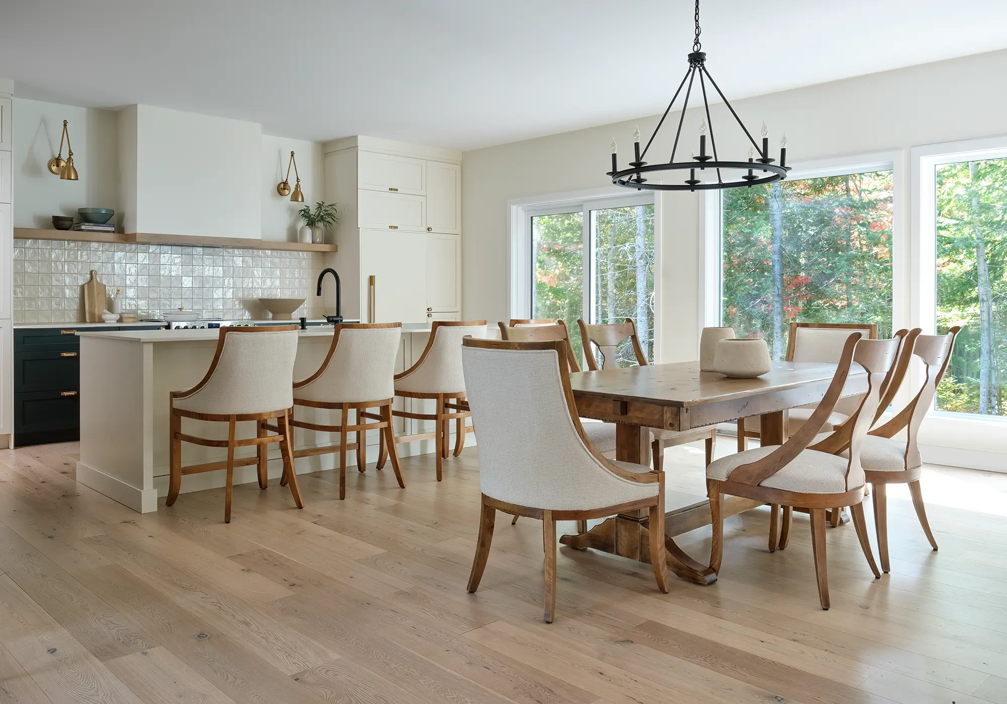 Canadel dining table and upholstered chairs in a bright, modern kitchen