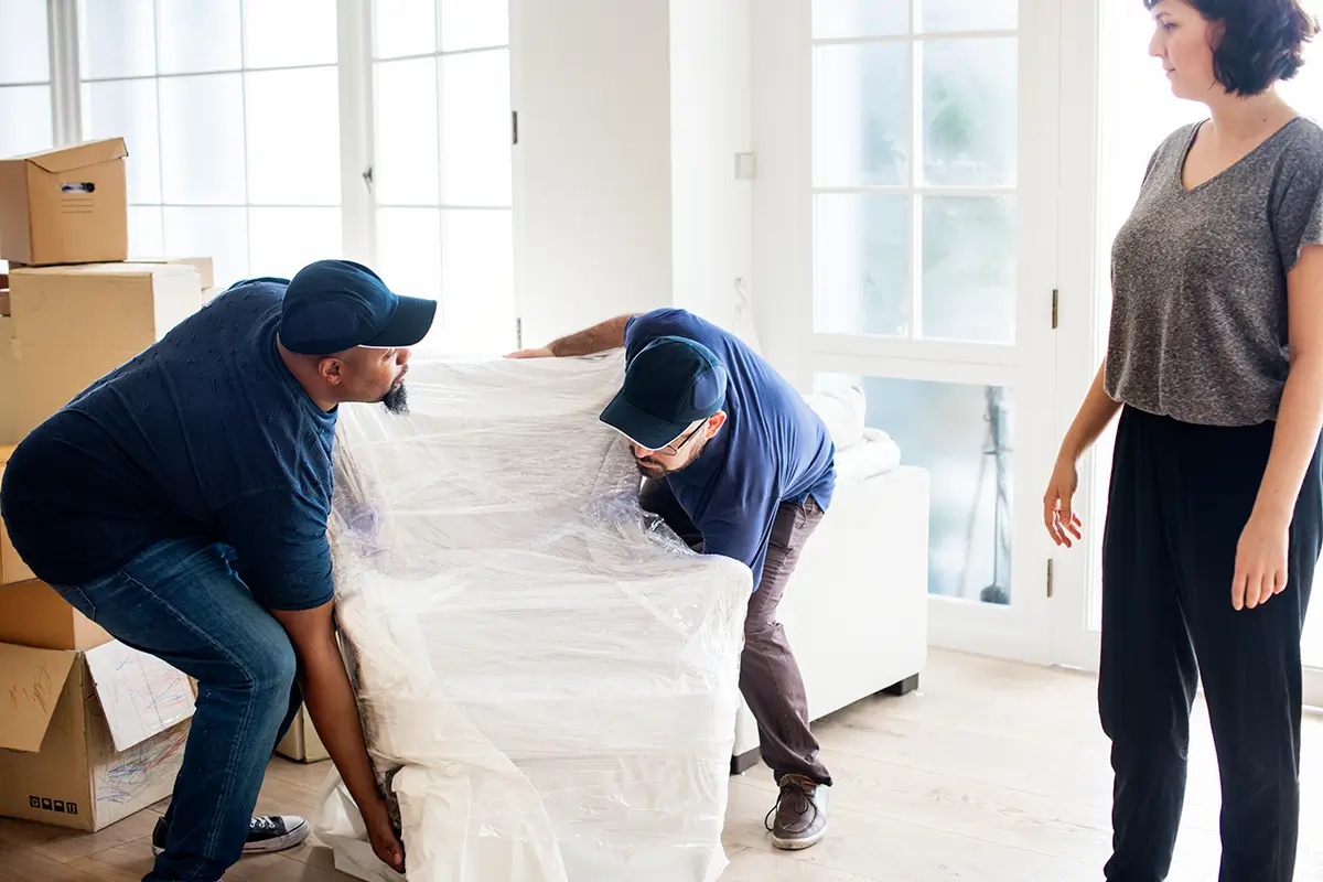 Delivery guys delivering furniture