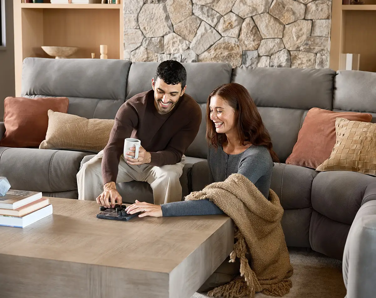 Couple in a living room playing a board game
