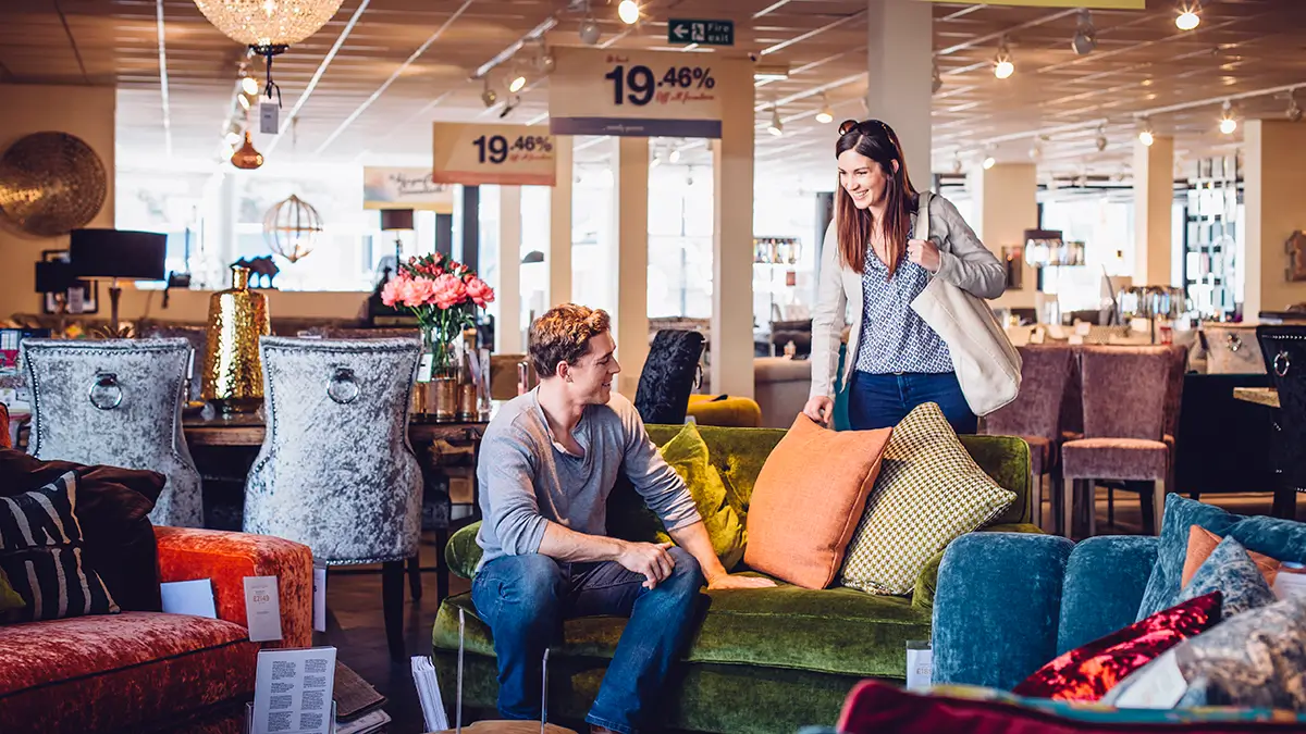 A couple shopping for furniture