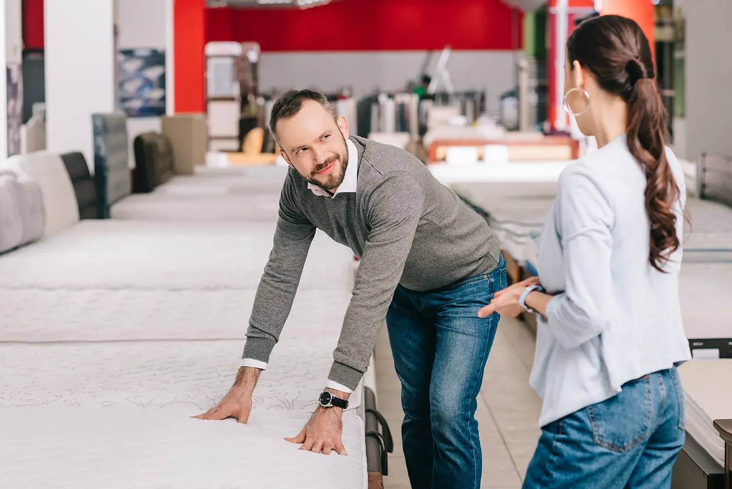 Couple bying a mattress in store