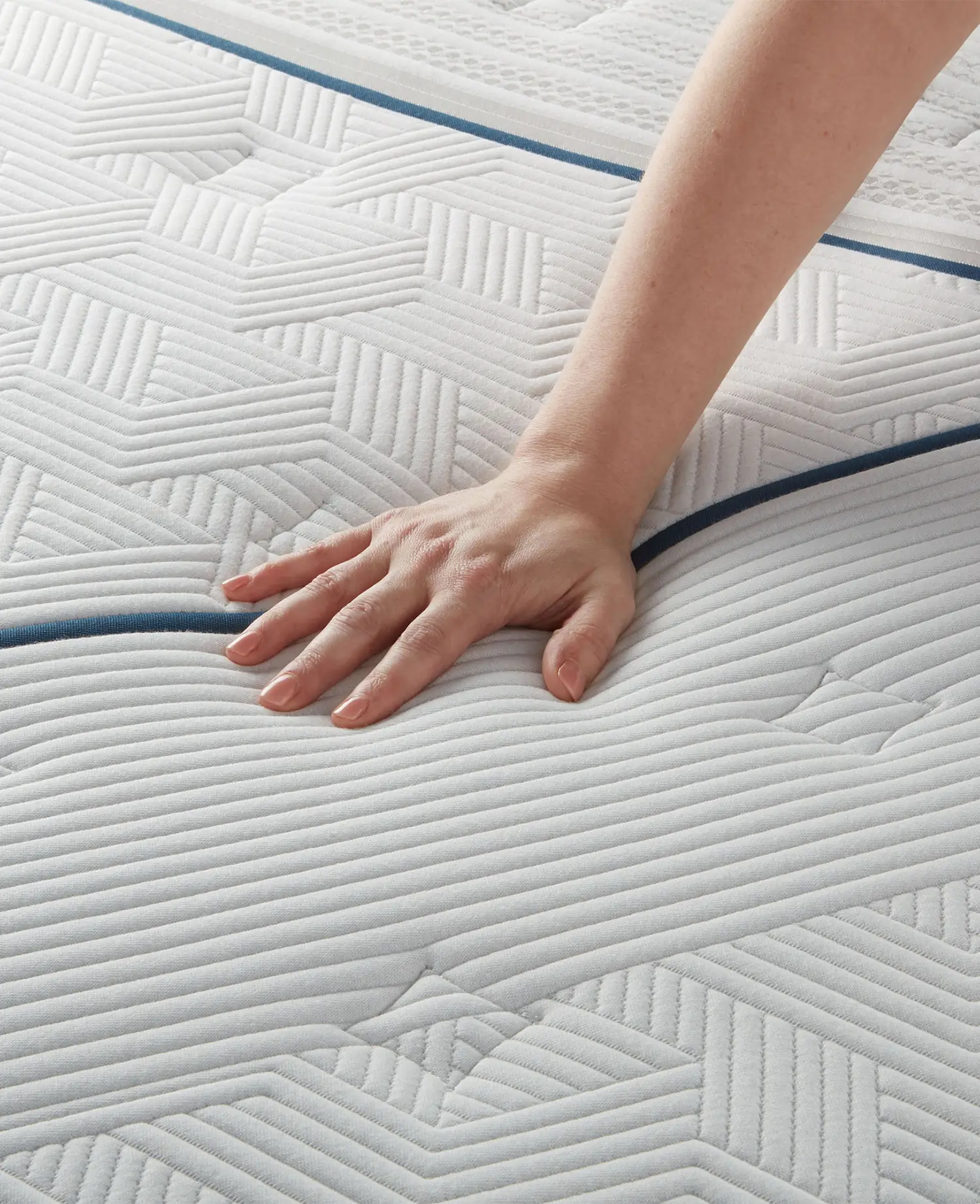 Hand on a firm mattress
