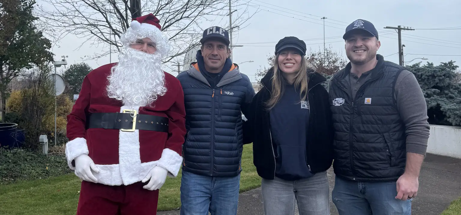 NEFD team standing with Santa during a charity event