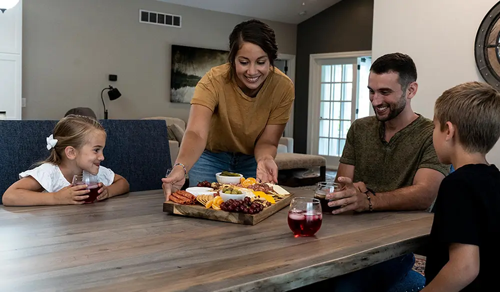 Family gathered around Amish dining table