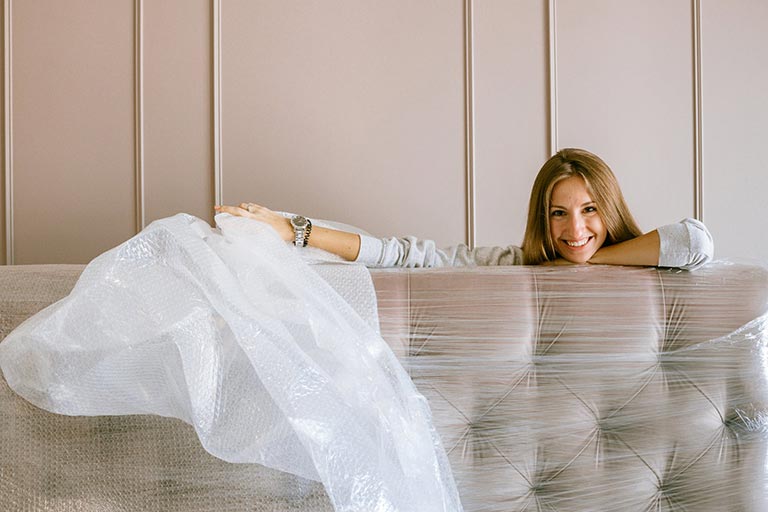 Person sitting on a bubble wrapped couch