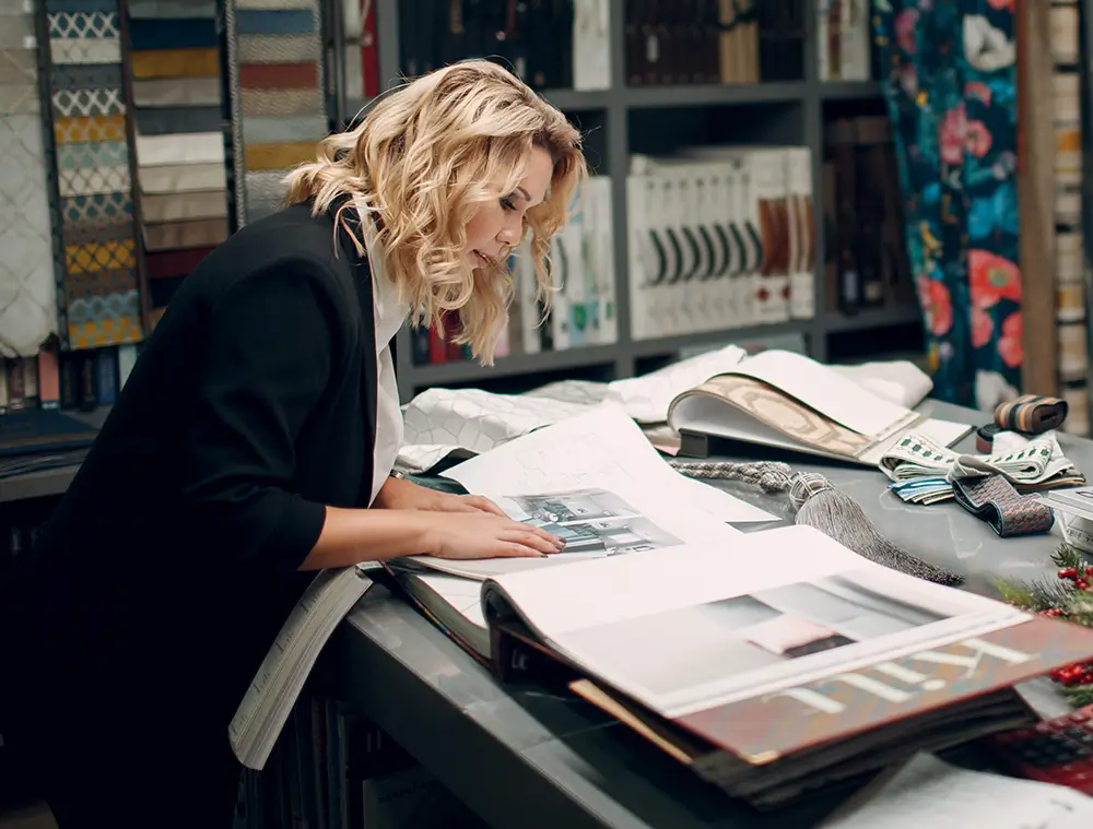 Design specialist looking through a furniture catalog