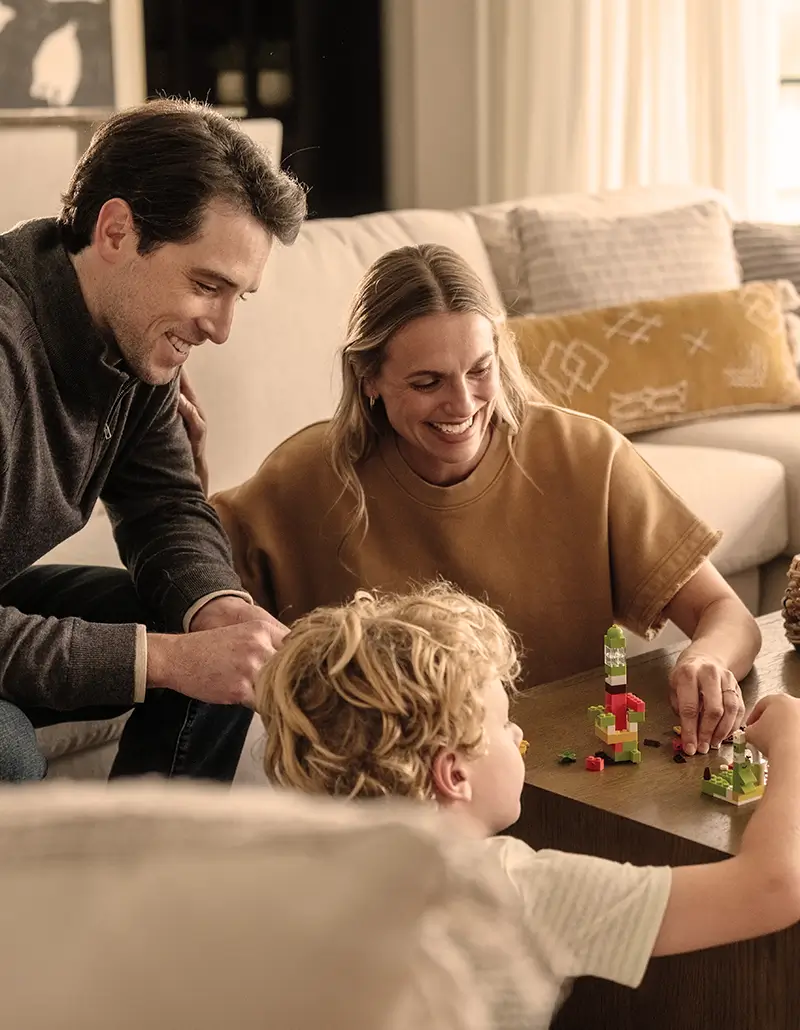 Family playing together in a living room